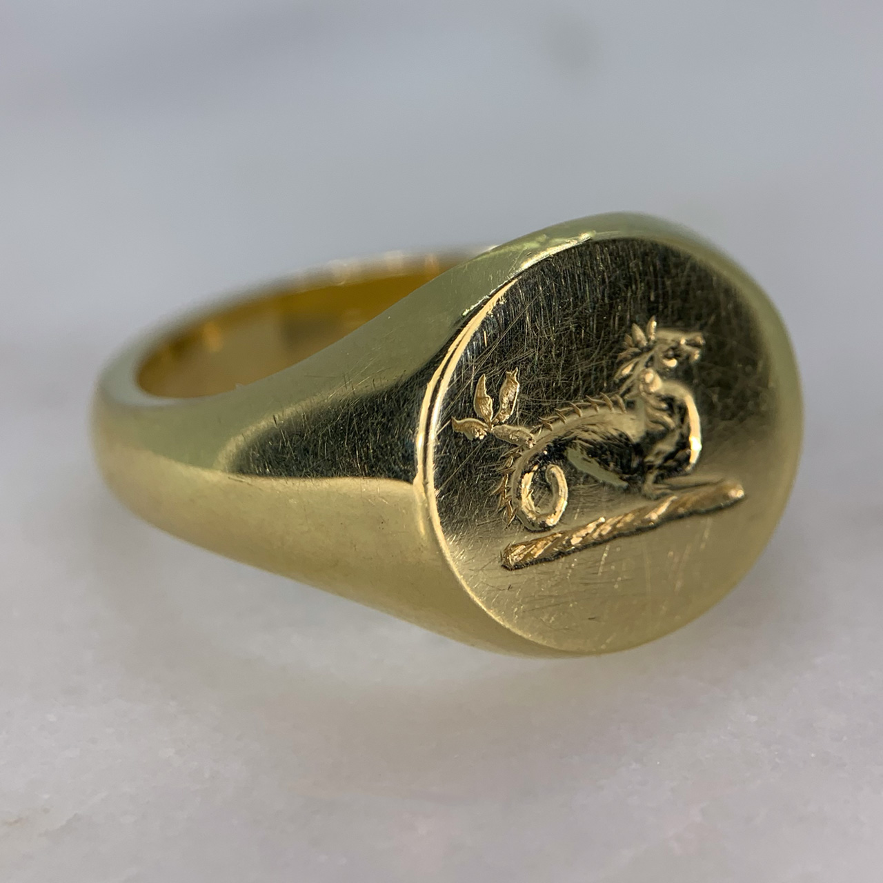 Fabulous Dragon Intaglio Signet Ring in marked 750 (18ct) yellow Gold. The dragon intaglio stamp measures 16.25mm x 15.42mm. The ring is in excellent condition, heavy on the hand with a polished shank.