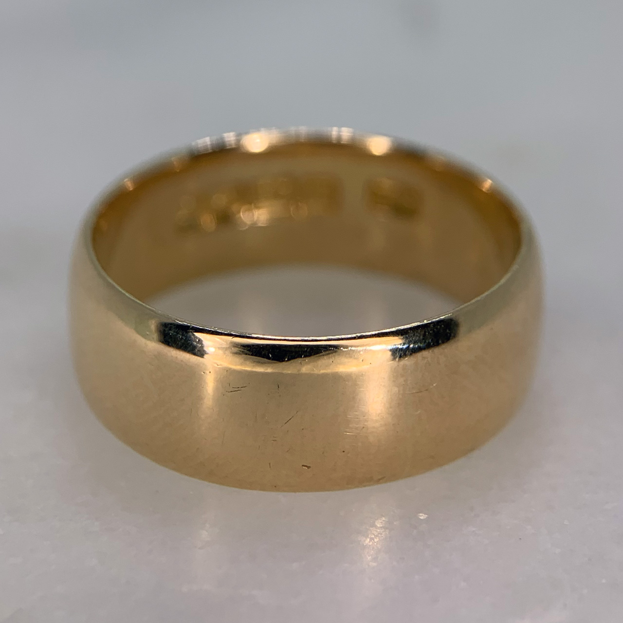 Half Round Wedding Band in 18ct dark yellow gold, Hallmarked Birmingham (1933). The Ring has a width of 8mm and has a super clear hallmark and makers mark inside the shank. This ring is in excellent condition. 