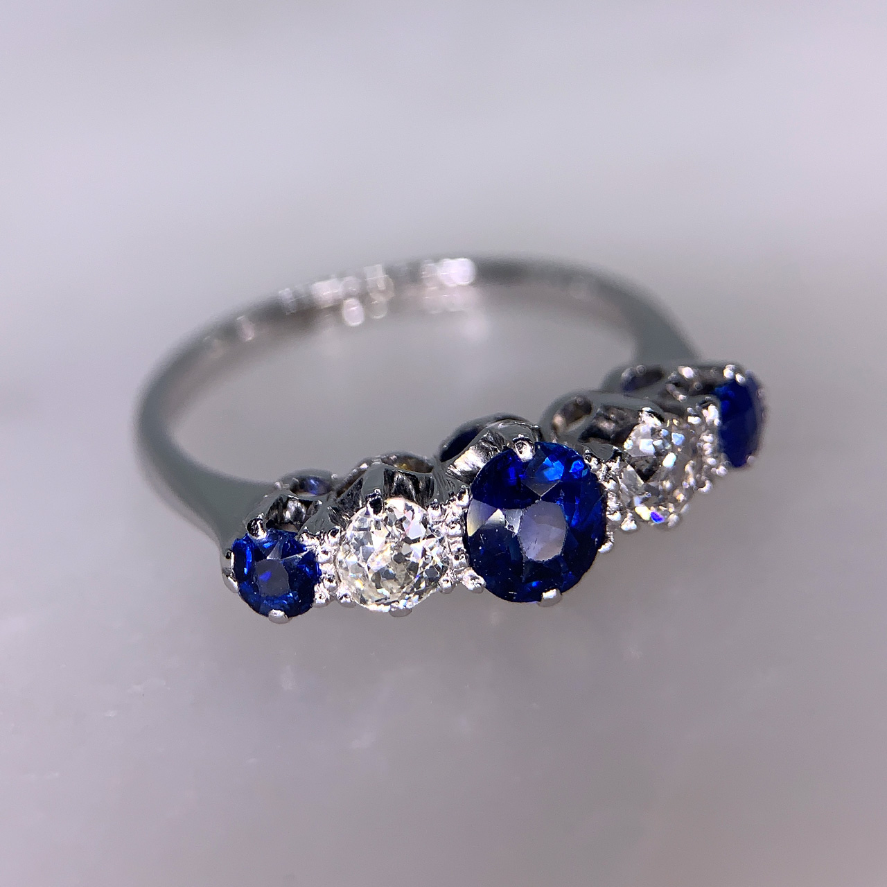Edwardian Sapphire and Diamond Half Hoop in hallmarked Platinum and 18ct White Gold. This is an exquisite multi-tone Sapphire and brilliant cut Diamond 5 stone half hoop,  all stones are claw set. The head of the ring is approximately 8.5mm x 6mm and sits within a smooth shank in the most perfect condition.